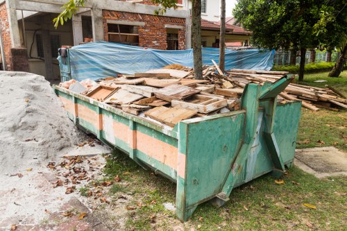 Operatives assessing a waste-filled flat before removal